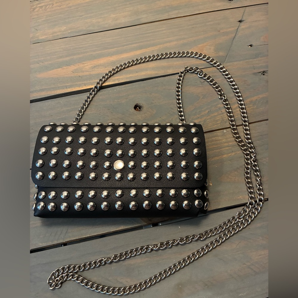 Studded black convertible cross body/waistlet.